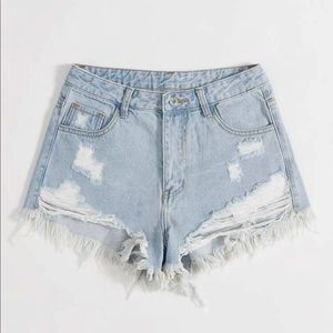 Ripped denim shorts.